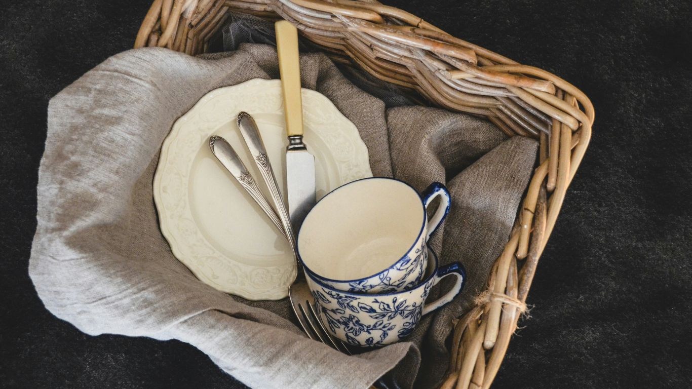 A steaming cup of teasemoonga with vibrant leaves.