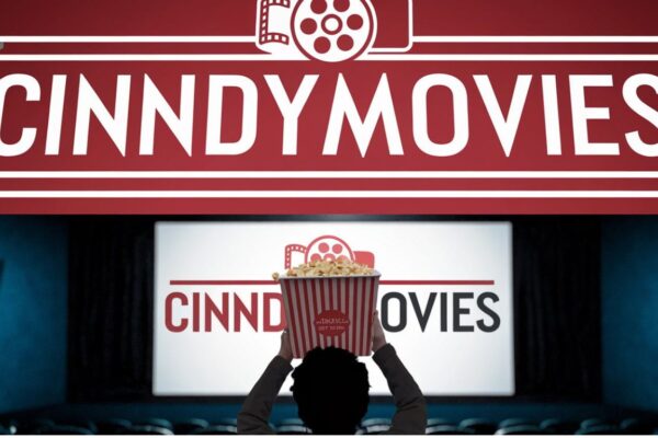 An engaging representation of cinndymovies with movie reels, popcorn, and a glowing theater screen in the background.