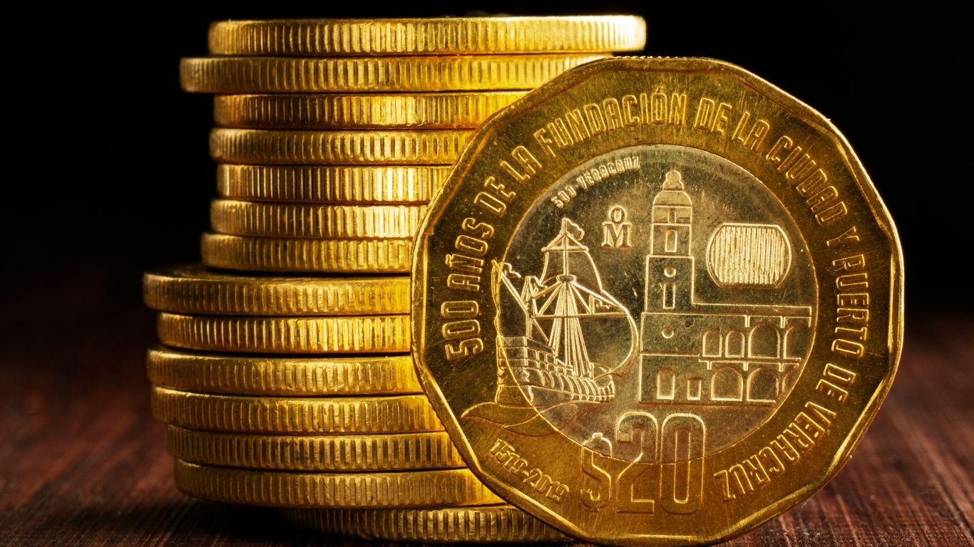 A gleaming gold quarter on a display, showcasing its rarity and detail.