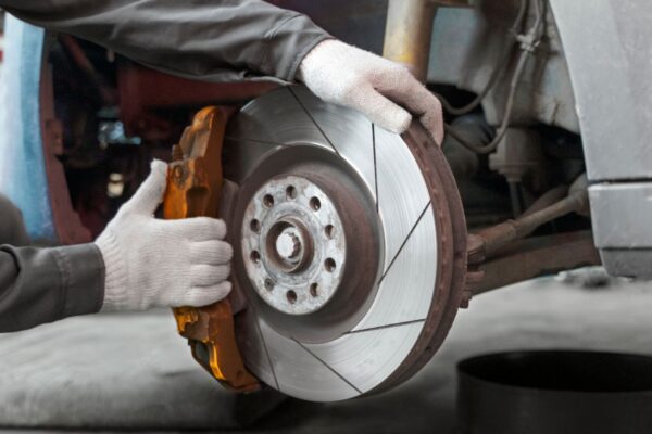 A close-up of 020bg brake calipers showcasing their design, durability, and high performance in a vehicle's braking system.