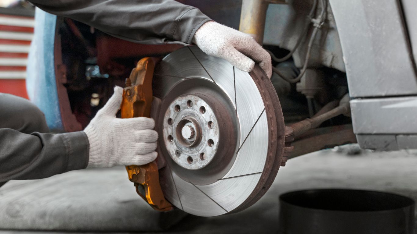 A close-up of 020bg brake calipers showcasing their design, durability, and high performance in a vehicle's braking system.